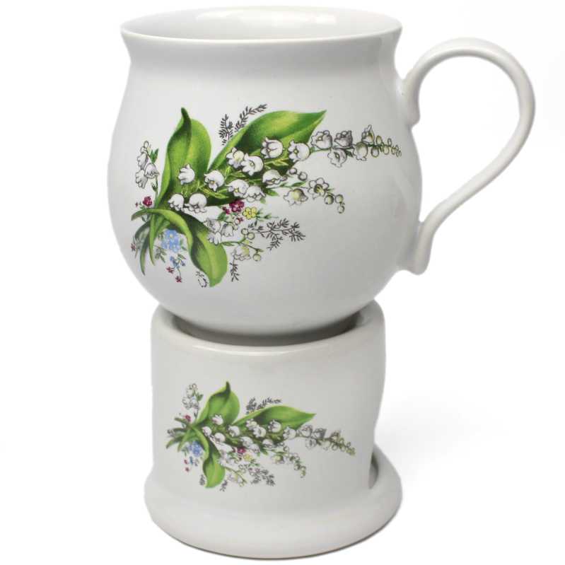 keramik tasse von 0,3 liter mit stövchen  inhalt verziert mit maiglöckchen