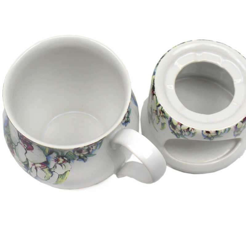 keramik tasse von 0,4 liter mit stövchen  inhalt verziert mit Orchidee