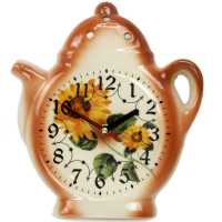 Beige keramik uhr in der teekanne form verziert mit sonnenblumen